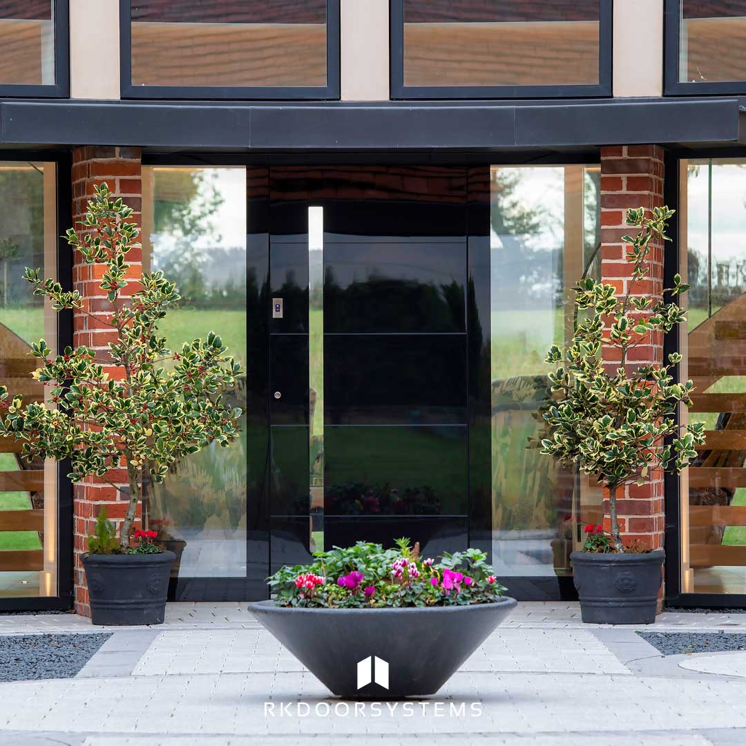 Modern pivot entrance door with sidelight