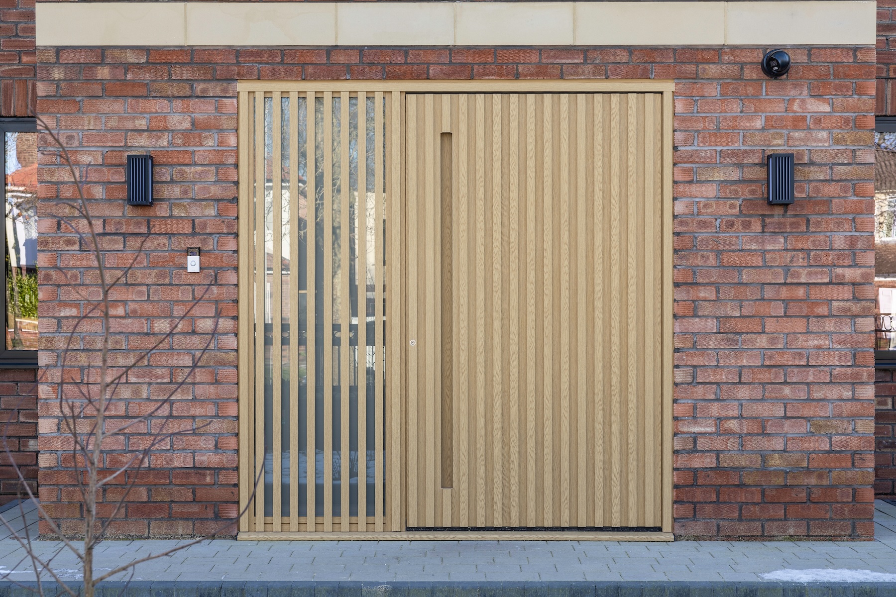 Bespoke slatted timber entrance door installed by AGG
